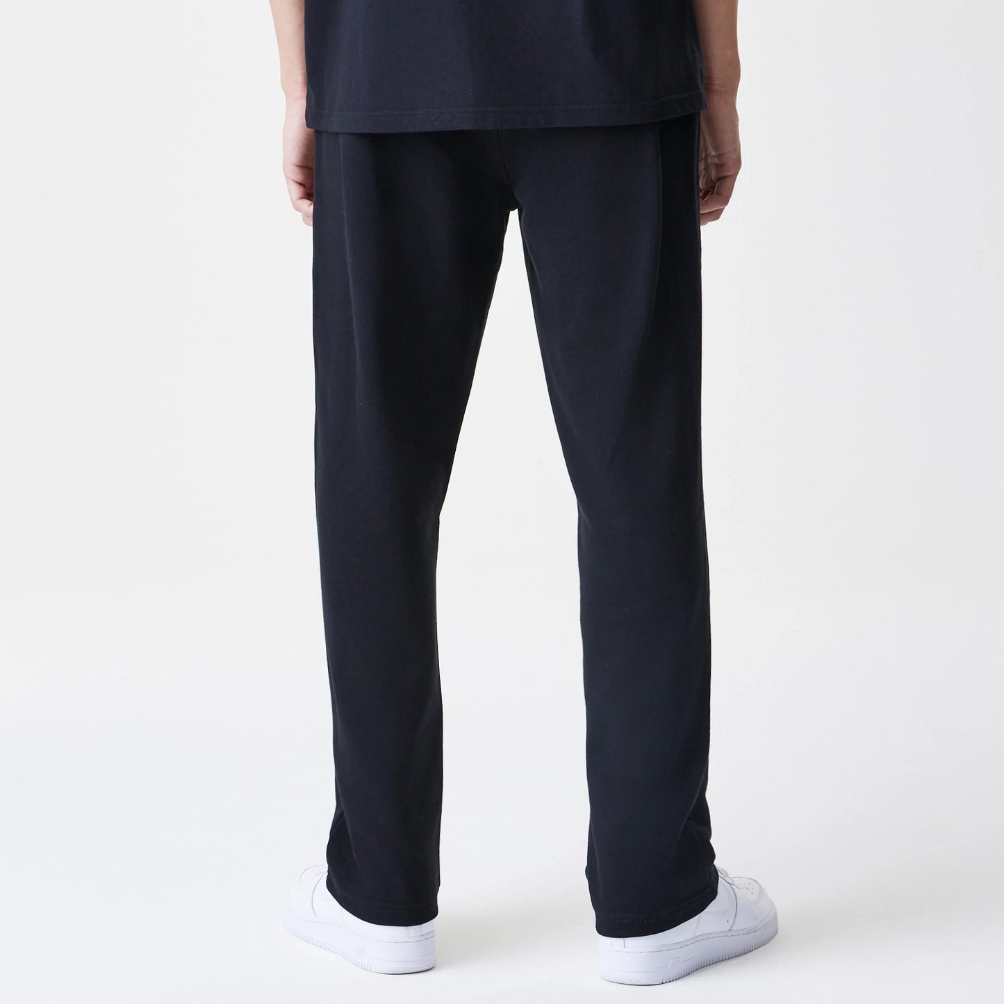 The Male model is wearing New Era Premium Essential Black Joggers 2