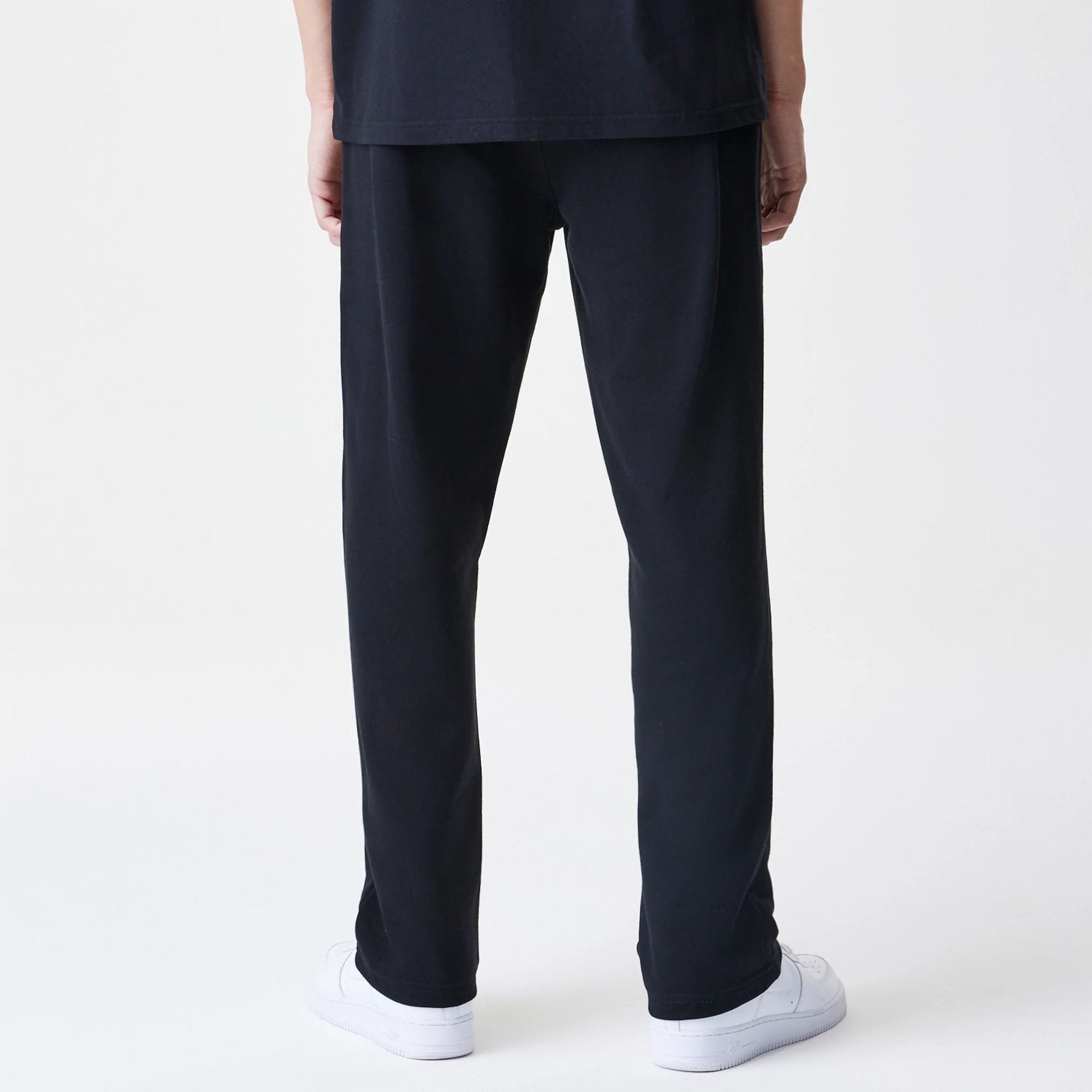 The Male model is wearing New Era Premium Essential Black Joggers 2