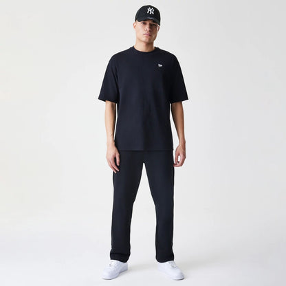 The Male model is wearing New Era Premium Essential Black Joggers 8
