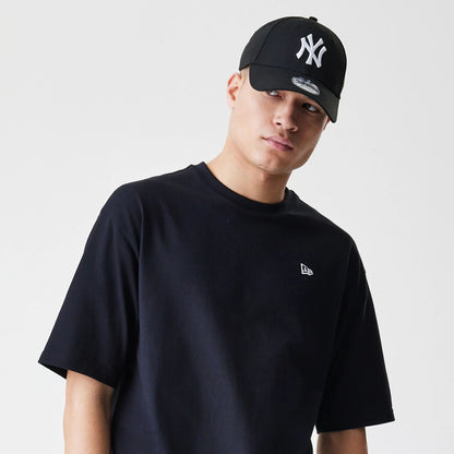 The Male model is wearing New Era Premium Essential Black Oversized T-Shirt 6