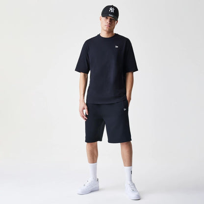 The Male model is wearing New Era Premium Essential Black Oversized T-Shirt 8
