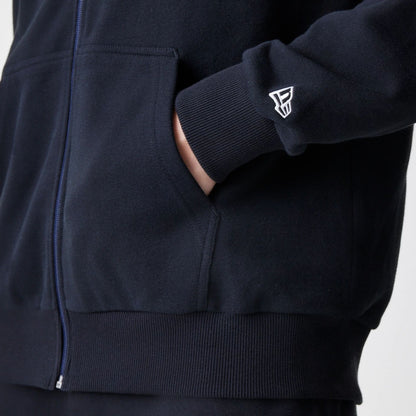 The Male model is wearing New Era Premium Essential Black Oversized Full Zip Hoodie 5