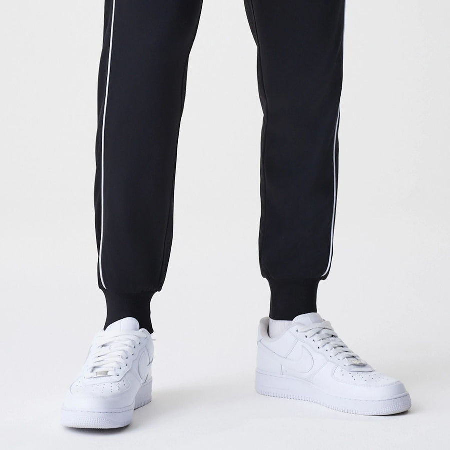 The Male model is wearing Chicago Bulls NBA Slim Black Track Pants 6