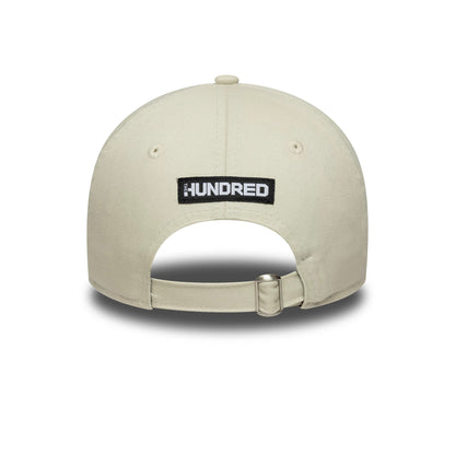 London Spirit The Hundred 2025 Contrast Light Beige New Era 9TWENTY Adjustable Cap, rear view showing the black and white embroidered The Hundred logo centred on the back panels, with a strap fastener and beige crown fabric.