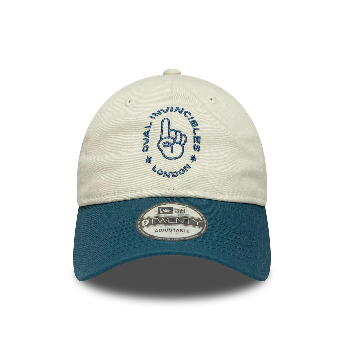 Oval Invincibles The Hundred 2025 Contrast Light Beige New Era 9TWENTY Adjustable Cap, front view showing navy embroidered logo on the beige crown with a contrasting dark teal visor and a 9TWENTY size sticker.