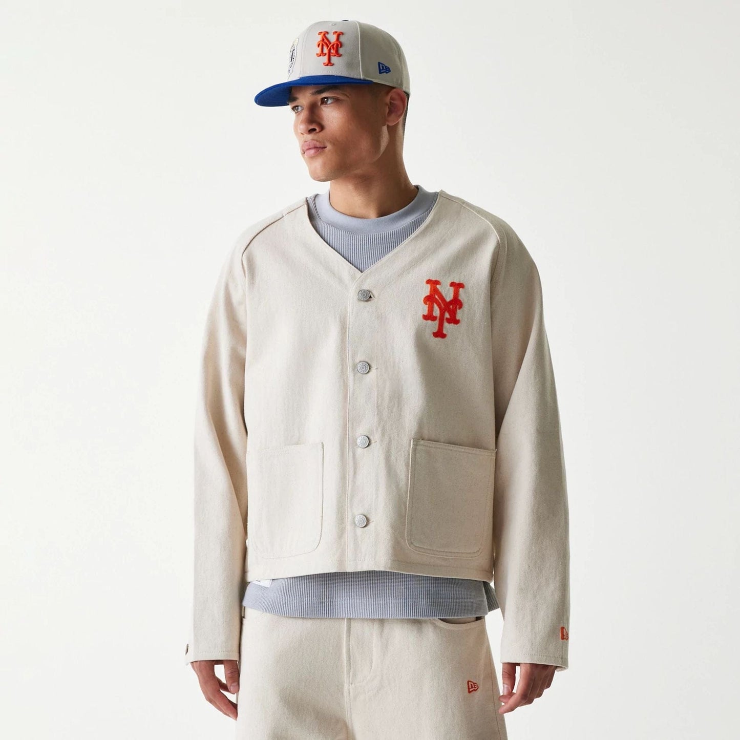 The Male model is wearing New York Mets MLB Cotton Open Cream Jacket 1