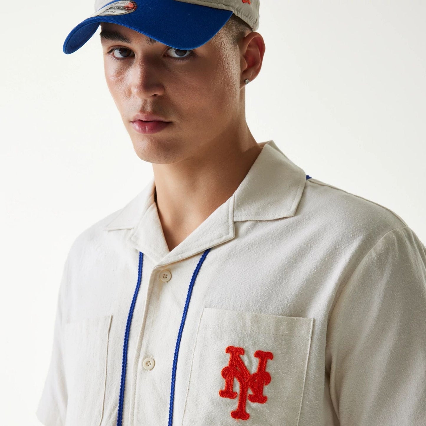 The Male model is wearing New York Mets MLB Piping Open Cream Short Sleeve Shirt 6