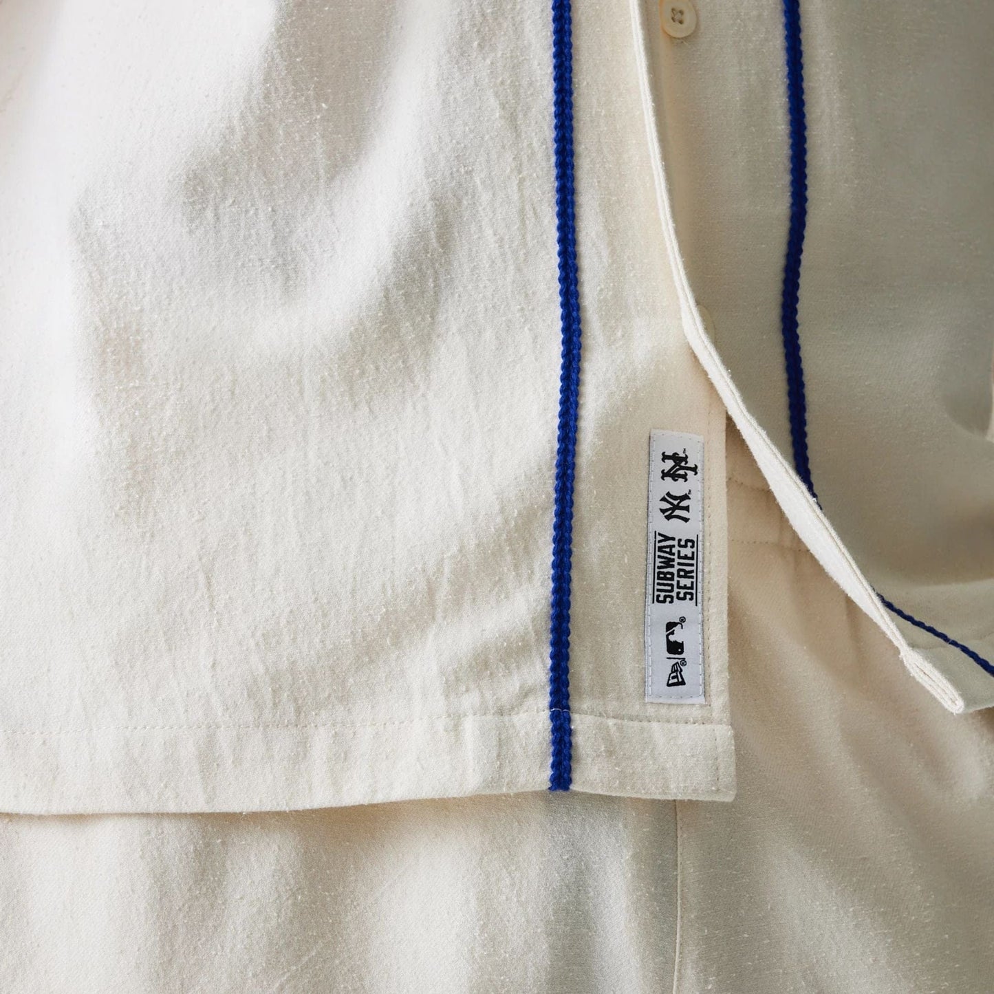 The Male model is wearing New York Mets MLB Piping Open Cream Short Sleeve Shirt 5