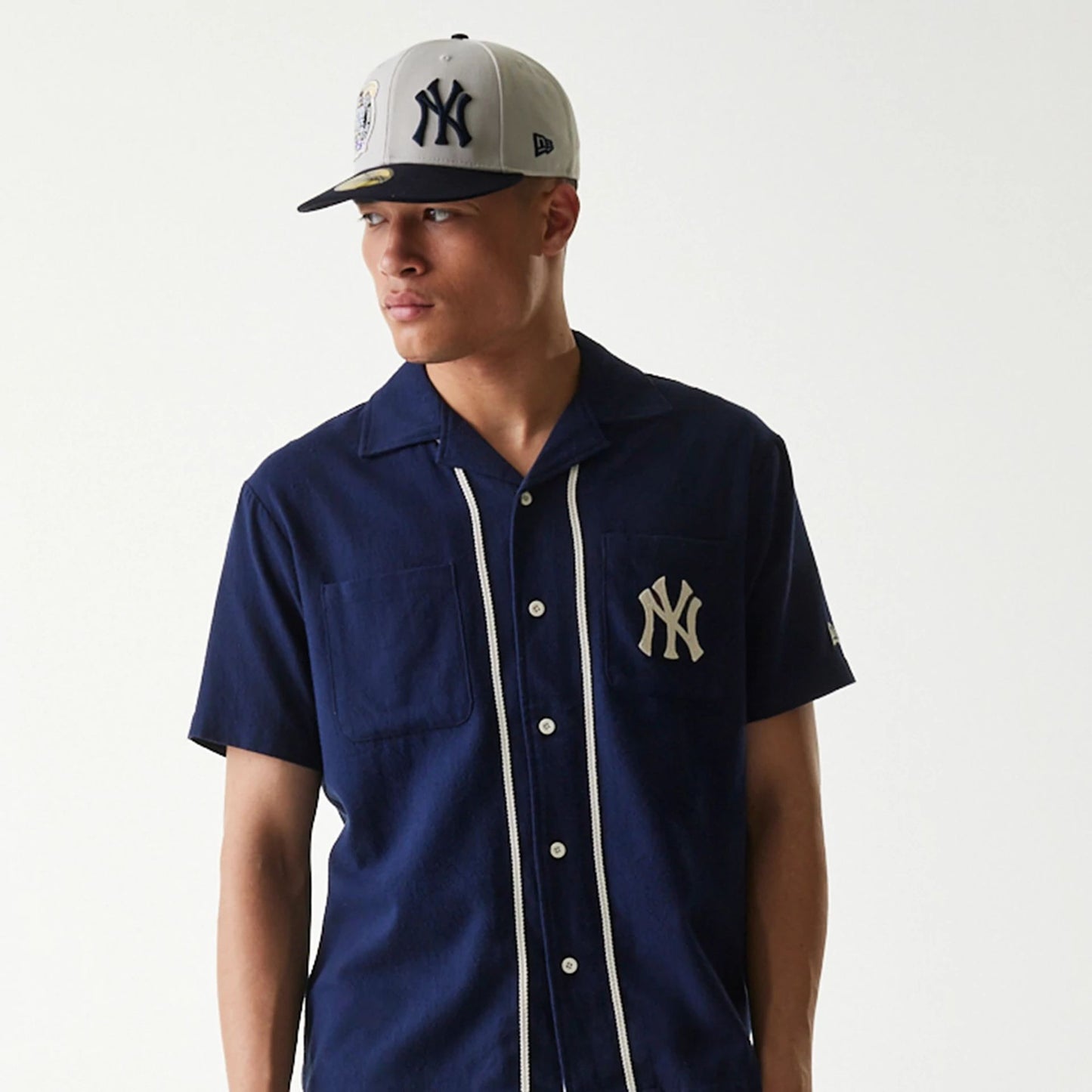 The Male model is wearing New York Yankees MLB Piping Navy Short Sleeve Shirt 3