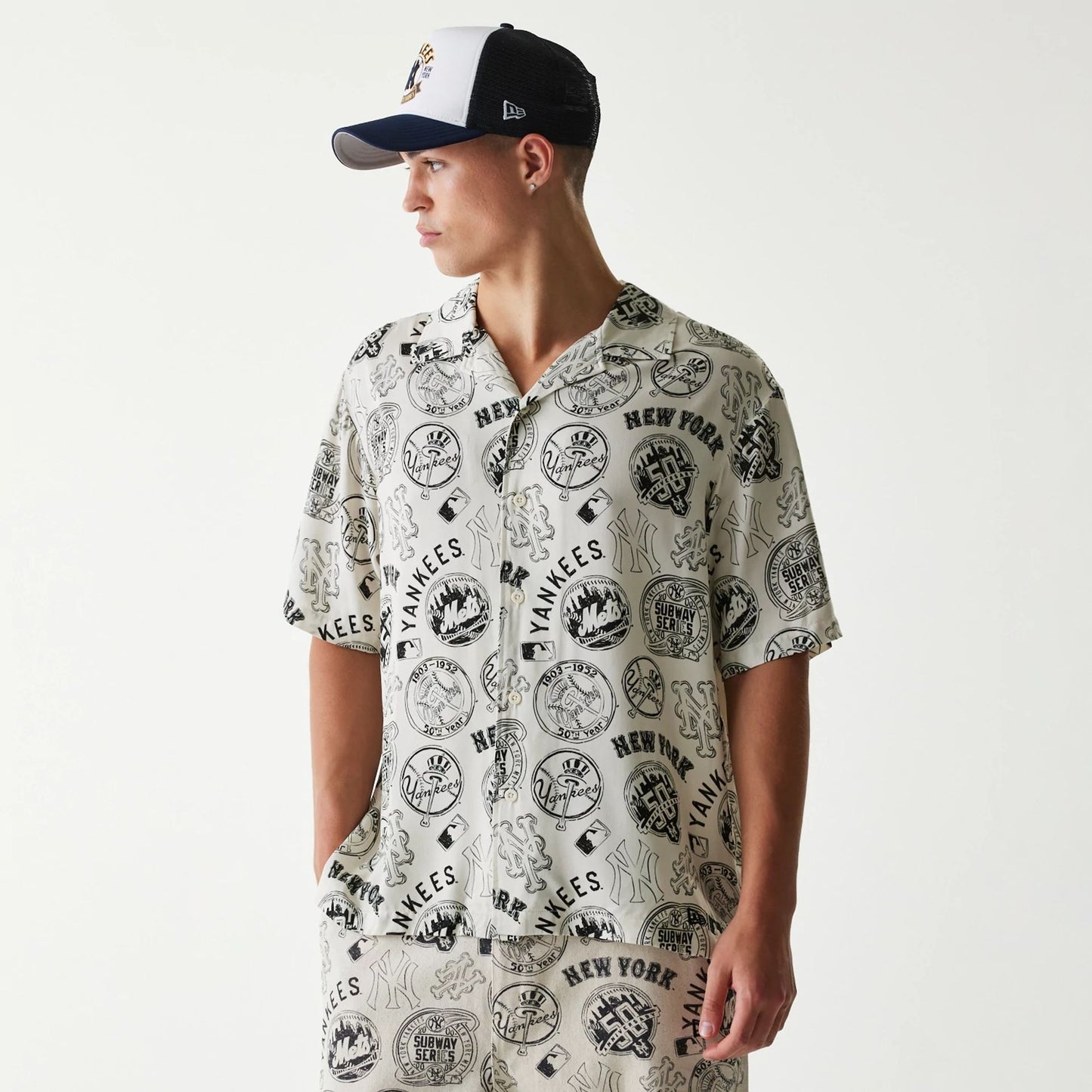 The Male model is wearing MLB Subway Series All Over Print Open White Short Sleeve Shirt 1