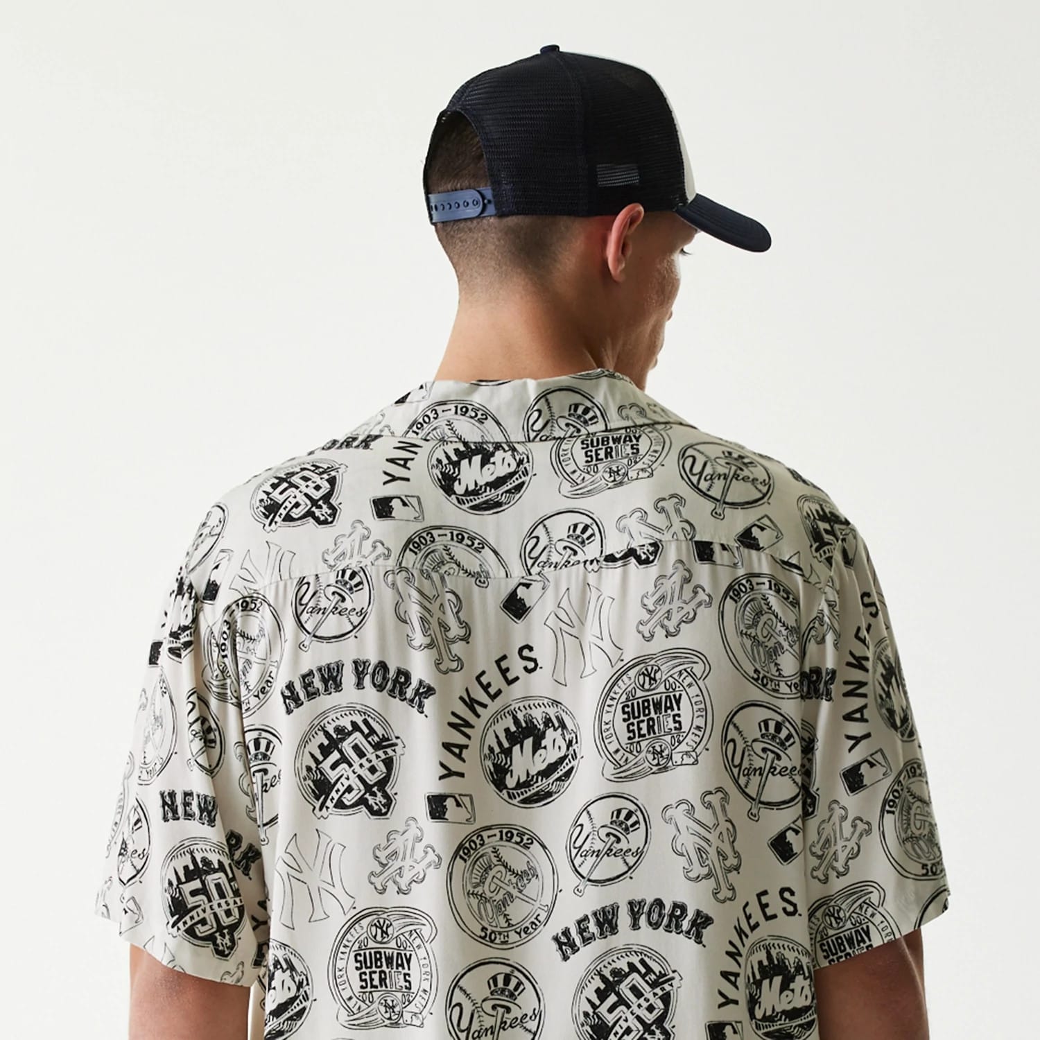 The Male model is wearing MLB Subway Series All Over Print Open White Short Sleeve Shirt 7