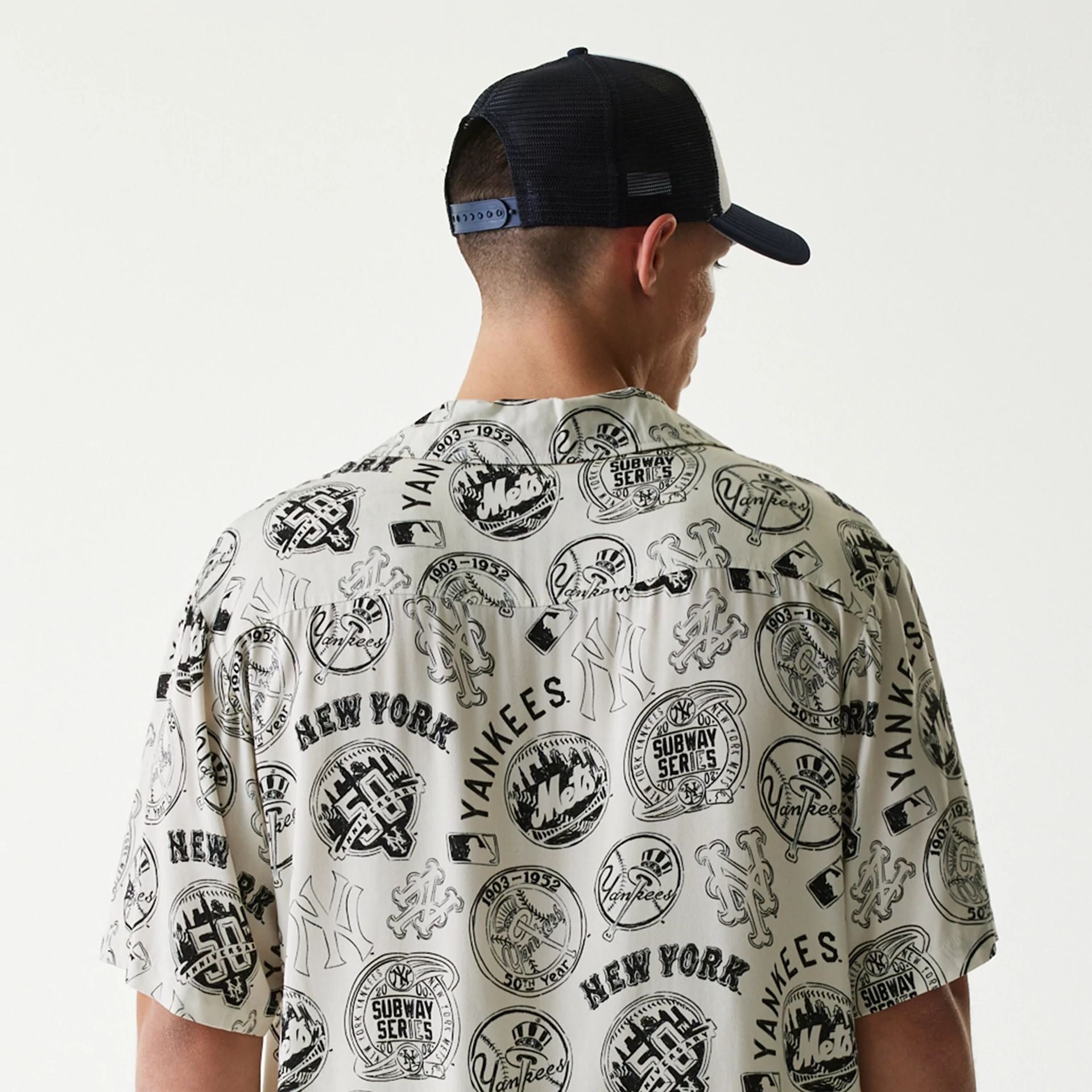 The Male model is wearing MLB Subway Series All Over Print Open White Short Sleeve Shirt 7