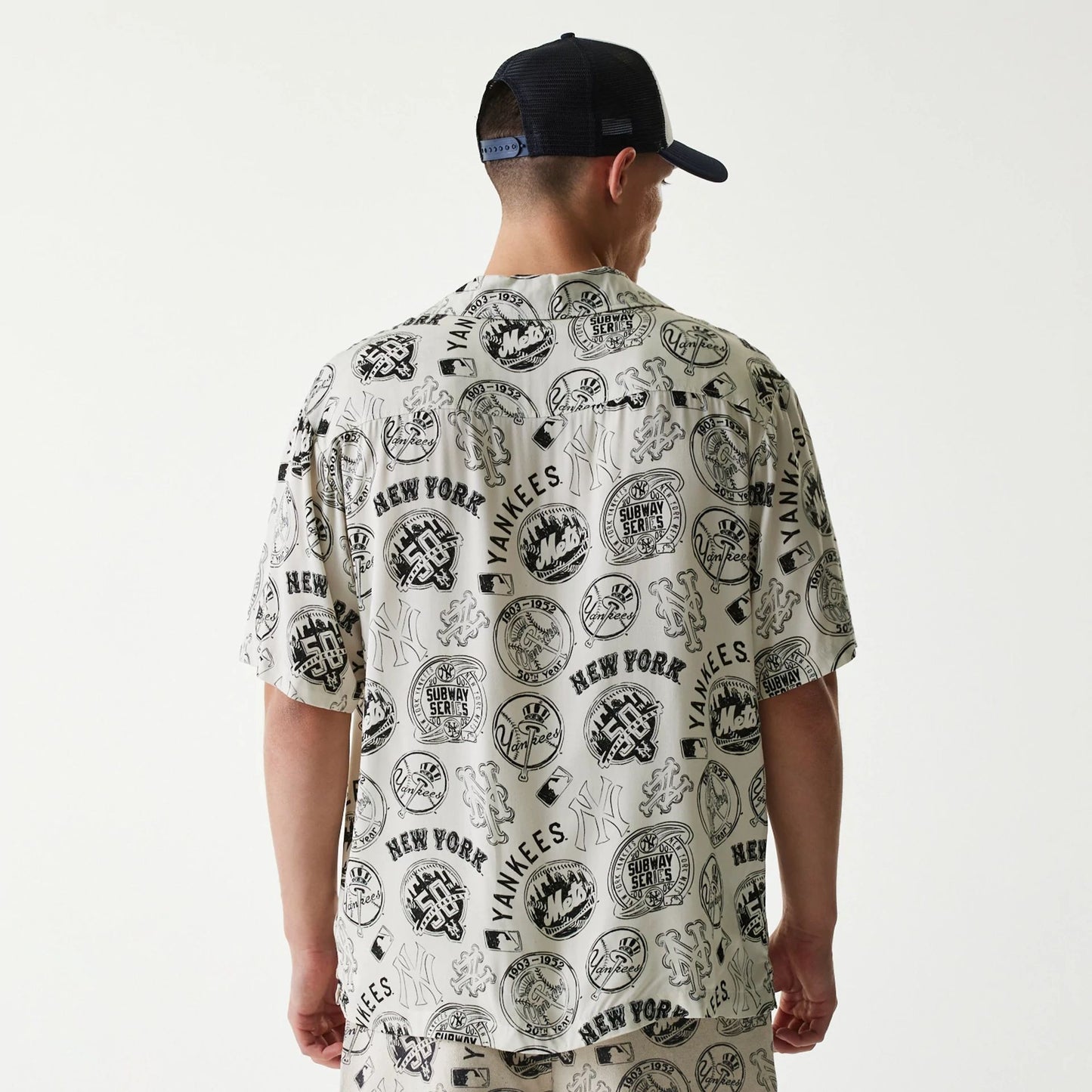 The Male model is wearing MLB Subway Series All Over Print Open White Short Sleeve Shirt 2
