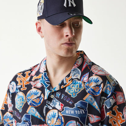 The Male model is wearing MLB Subway Series All Over Print Navy Short Sleeve Shirt 6