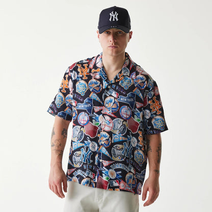 The Male model is wearing MLB Subway Series All Over Print Navy Short Sleeve Shirt 1