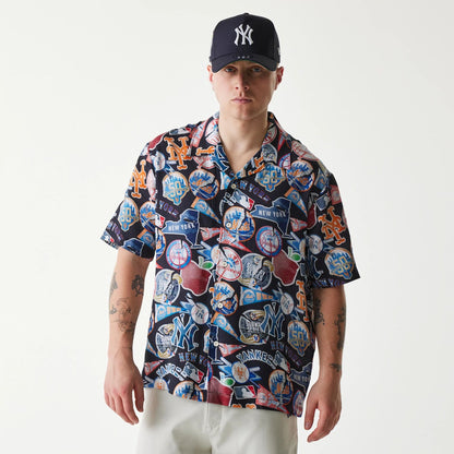 The Male model is wearing MLB Subway Series All Over Print Navy Short Sleeve Shirt 1