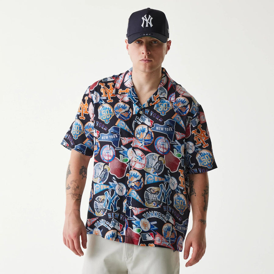The Male model is wearing MLB Subway Series All Over Print Navy Short Sleeve Shirt 1