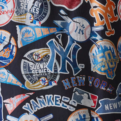 The Male model is wearing MLB Subway Series All Over Print Navy Short Sleeve Shirt 5