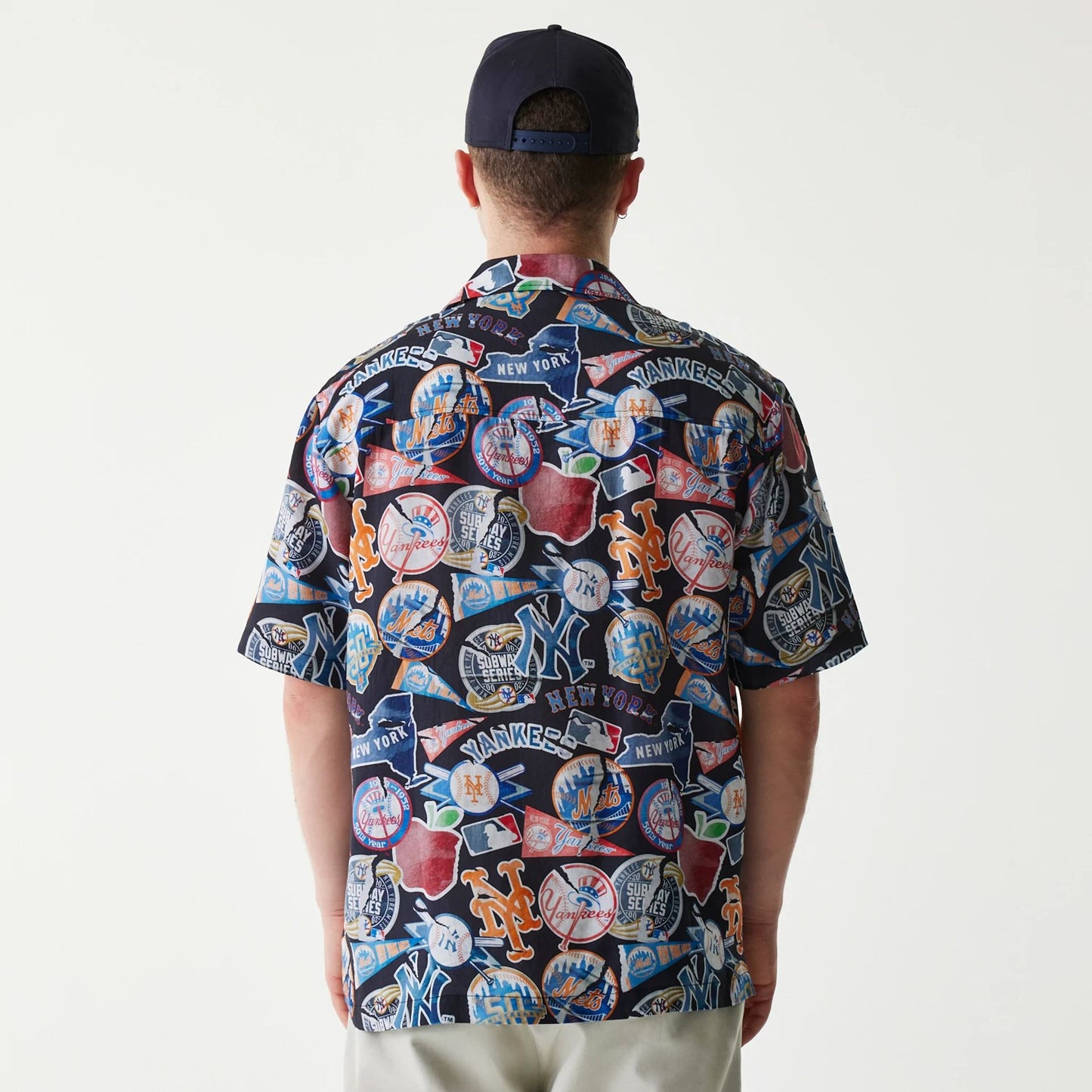 The Male model is wearing MLB Subway Series All Over Print Navy Short Sleeve Shirt 2