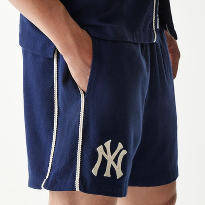 The Male model is wearing New York Yankees MLB Piping Navy Shorts 3