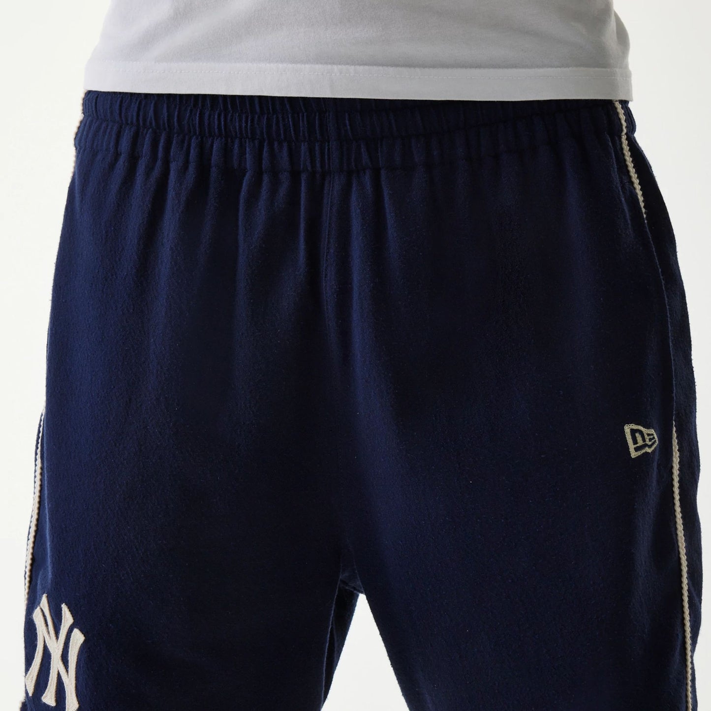 The Male model is wearing New York Yankees MLB Piping Navy Shorts 5
