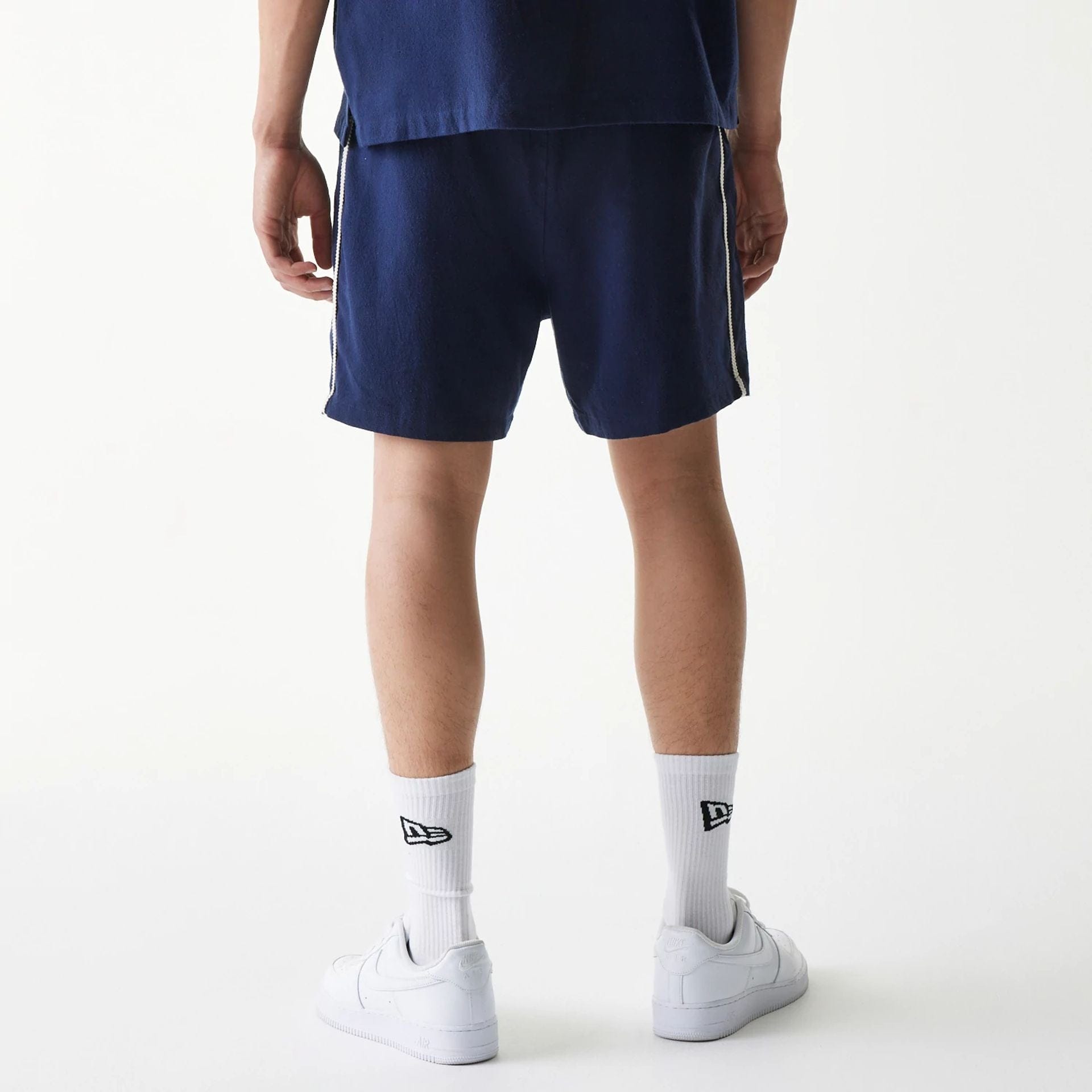 The Male model is wearing New York Yankees MLB Piping Navy Shorts 2