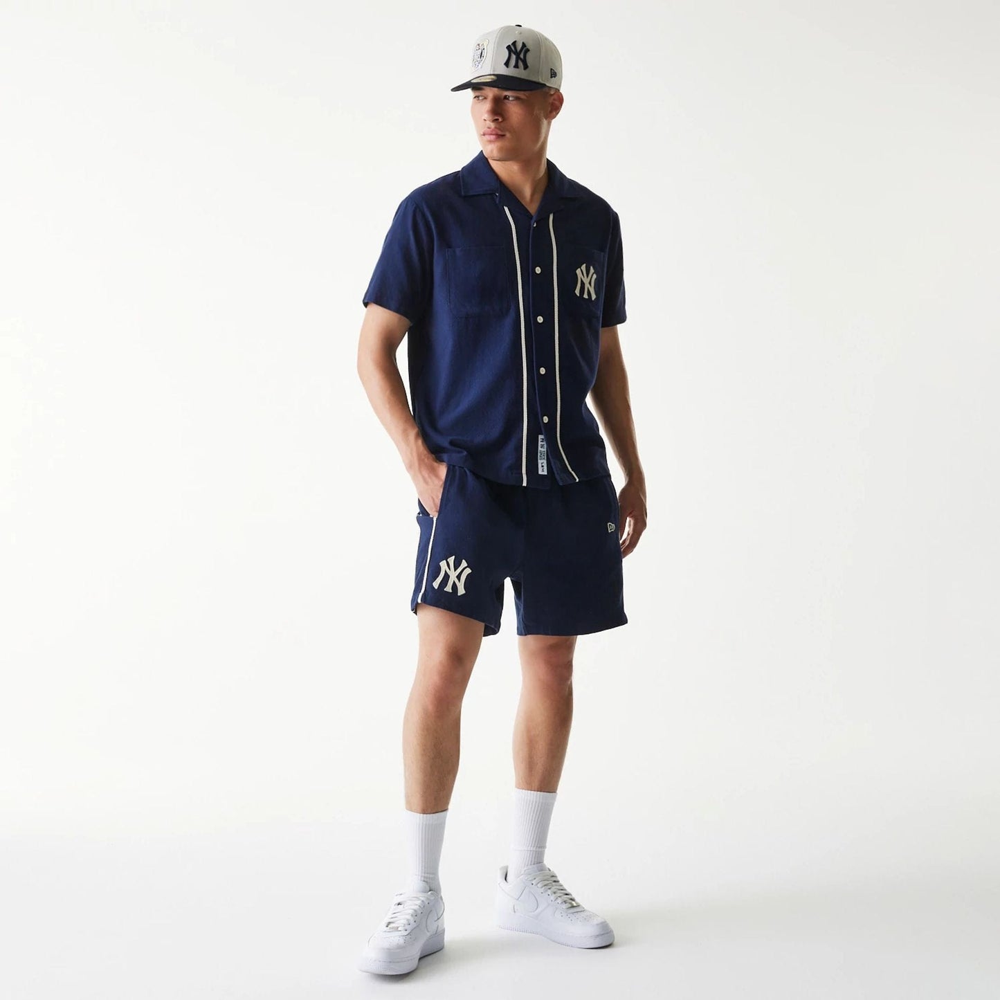 The Male model is wearing New York Yankees MLB Piping Navy Shorts 7
