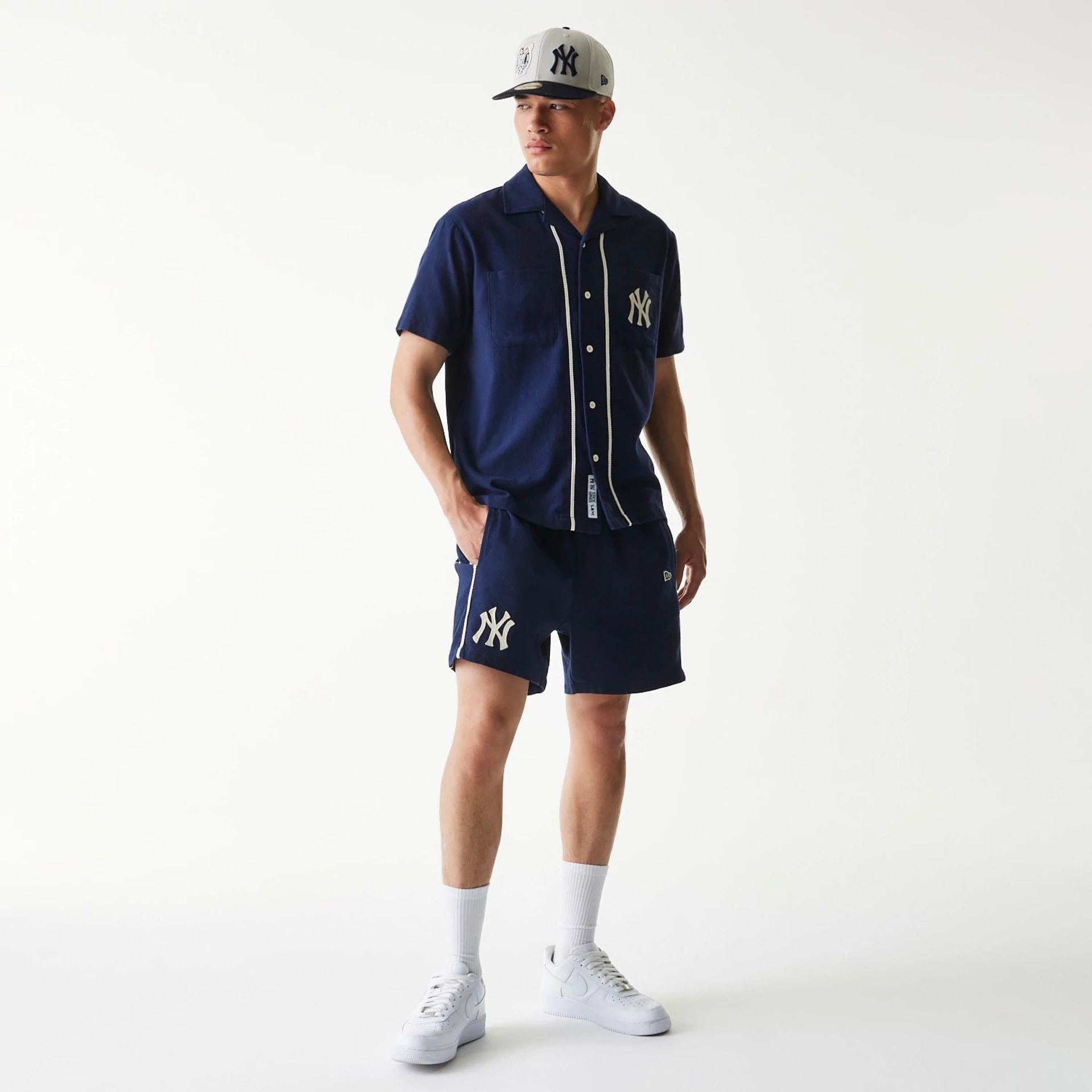 The Male model is wearing New York Yankees MLB Piping Navy Shorts 7