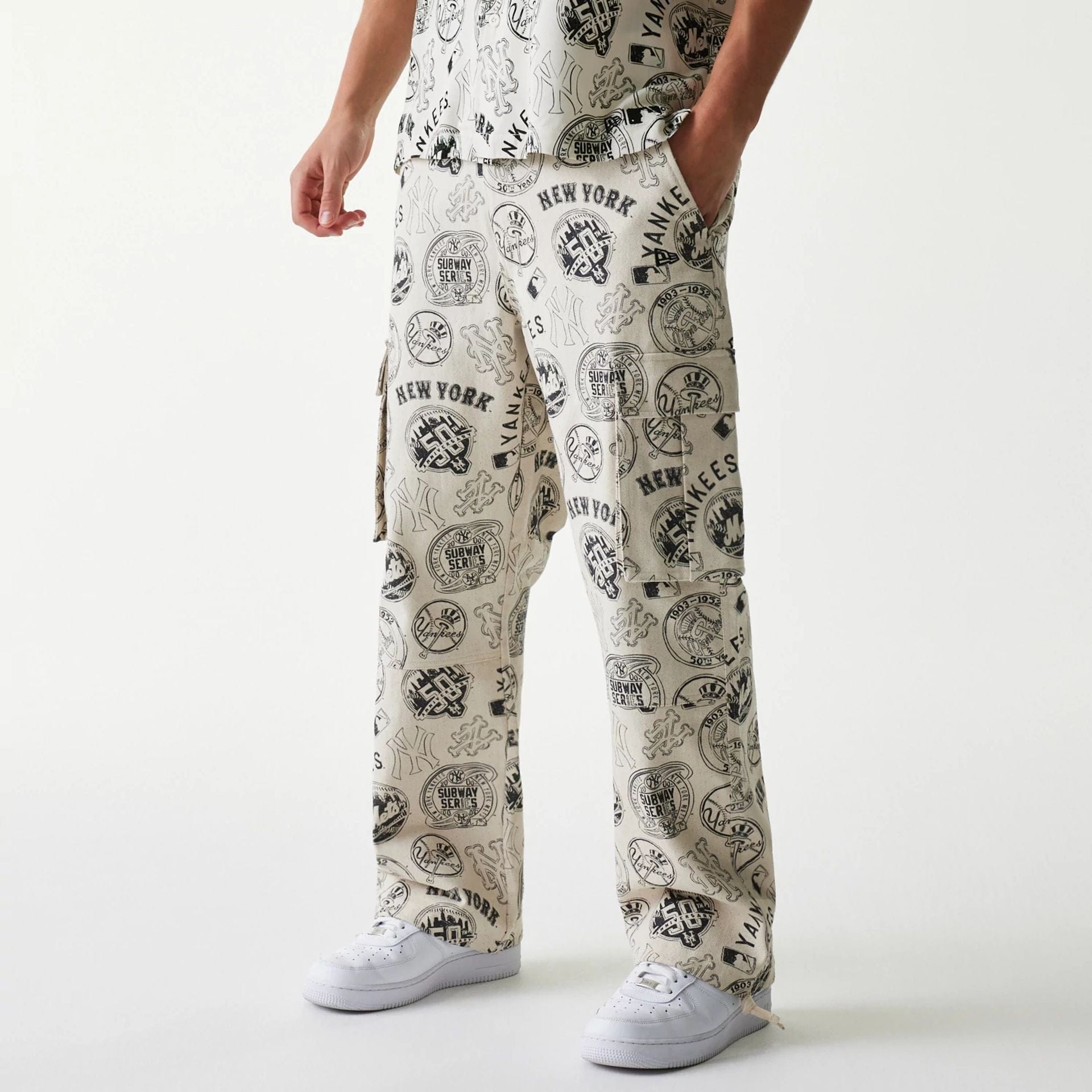 The Male model is wearing MLB Subway Series All Over Print Cargo Trousers 1