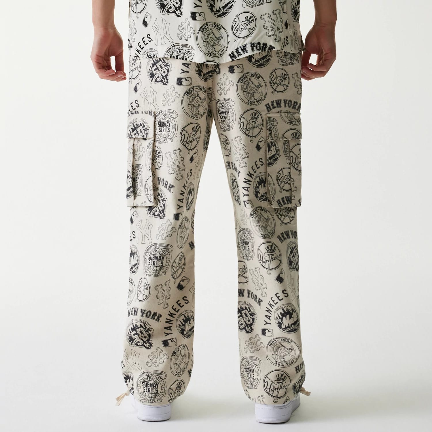 The Male model is wearing MLB Subway Series All Over Print Cargo Trousers 2