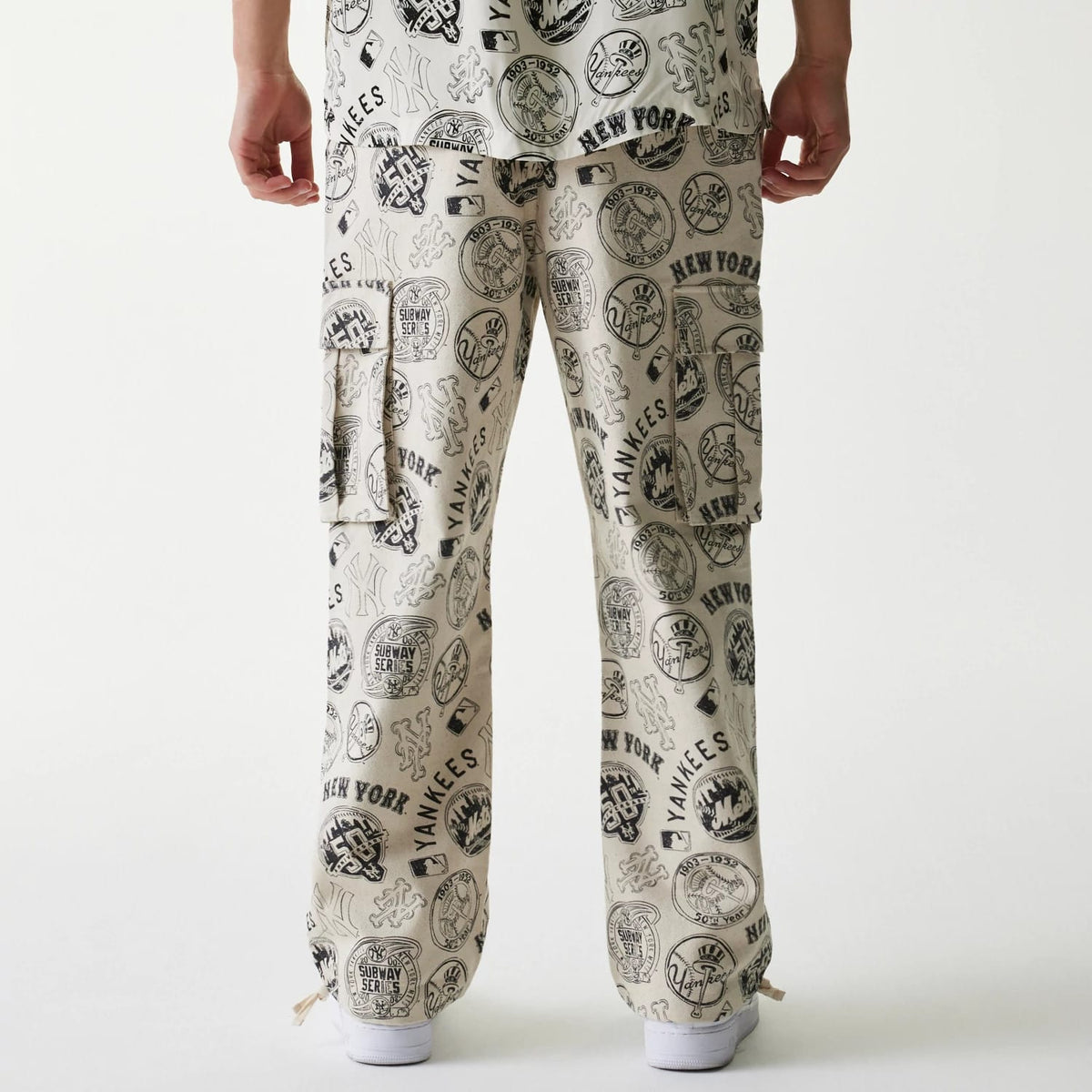 The Male model is wearing MLB Subway Series All Over Print Cargo Trousers 2