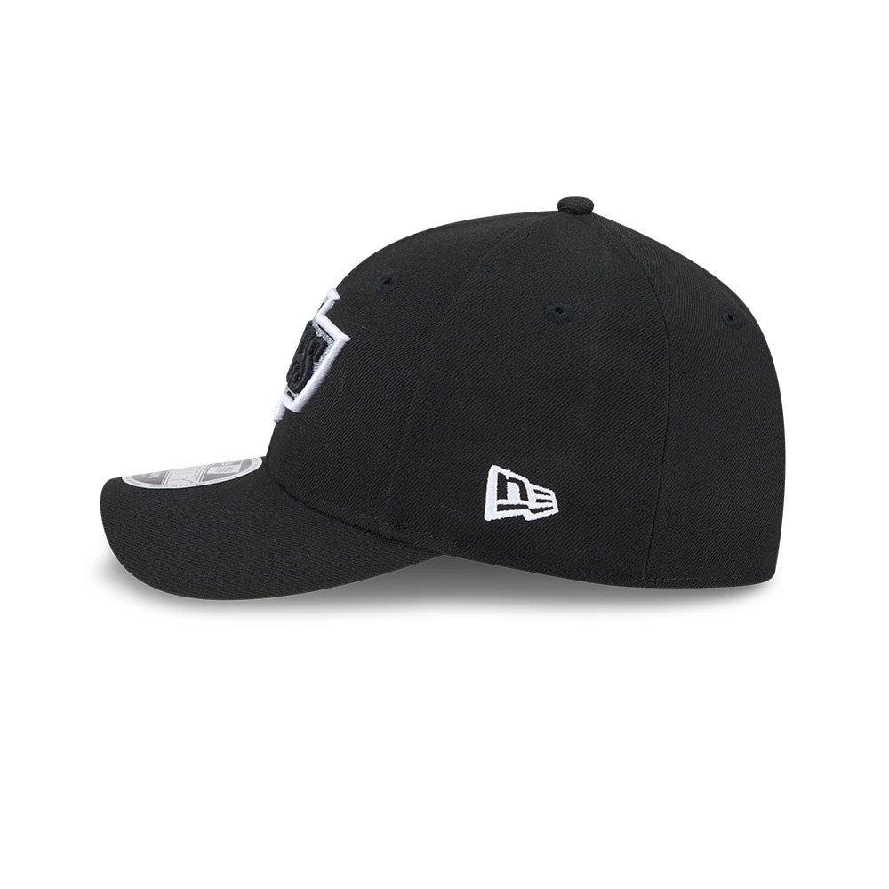LA Kings NHL Team Black New Era 9FORTY M-Crown Adjustable Cap, side view showing the white New Era flag logo embroidered on the left side of the black crown, with a curved black visor and size sticker.