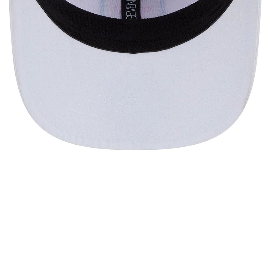 This is a Rangegoats LIV Golf 2025 White 9SEVENTY Stretch Snap Adjustable Cap 7