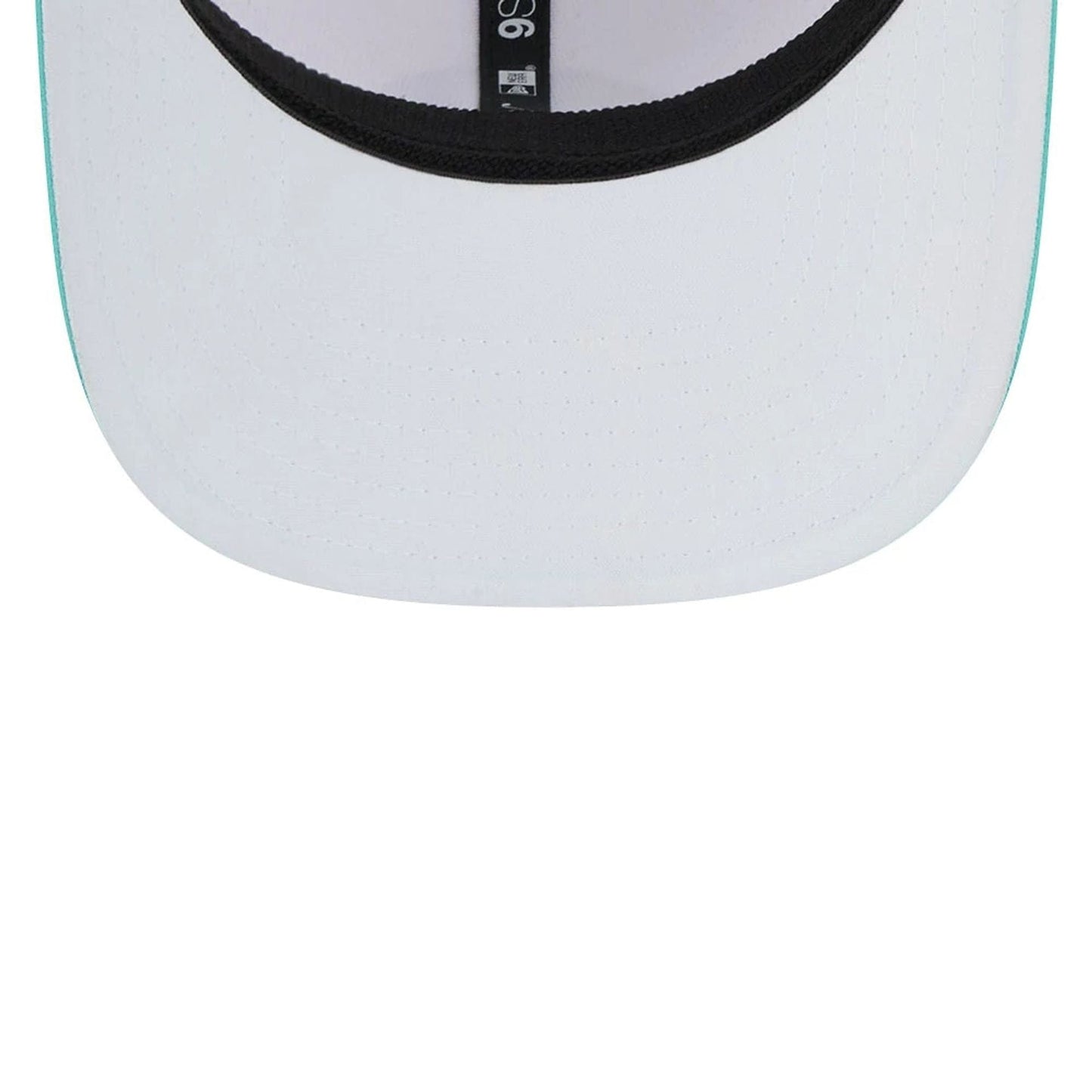 This is a Torque LIV Golf 2025 White 9SEVENTY Stretch Snap Adjustable Cap 2