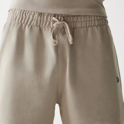 The Male model is wearing McLaren Racing Wordmark Light Beige Oversized Shorts 5