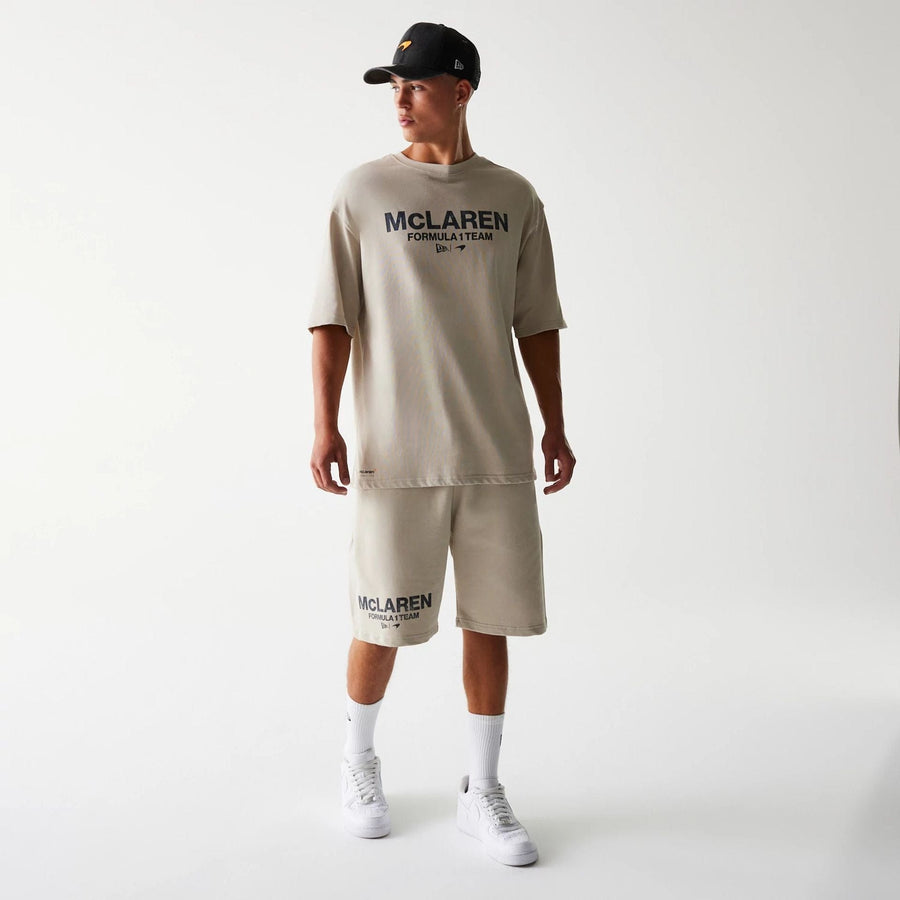 The Male model is wearing McLaren Racing Wordmark Light Beige Oversized Shorts 8