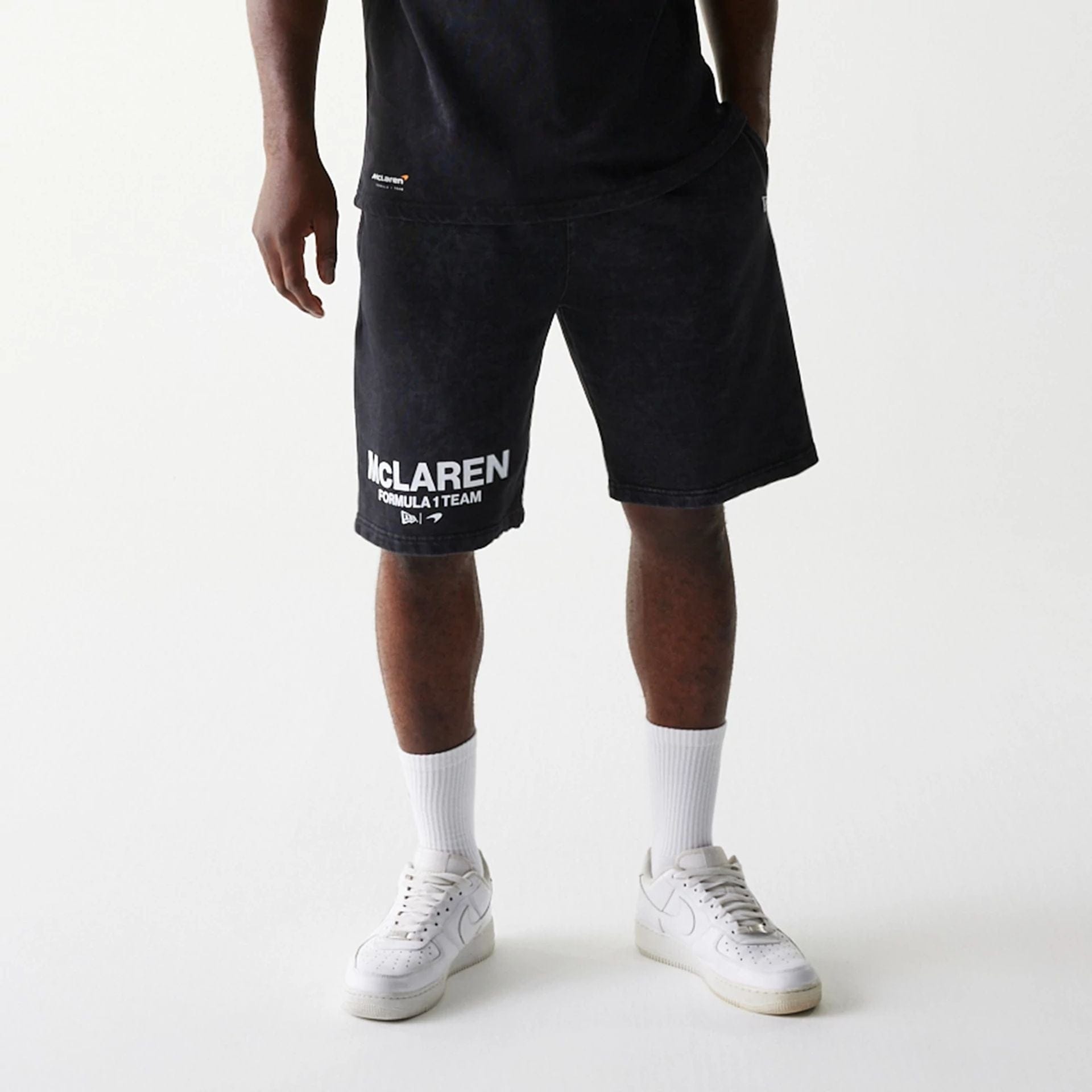 The Male model is wearing McLaren Racing Wordmark Black Oversized Shorts 8