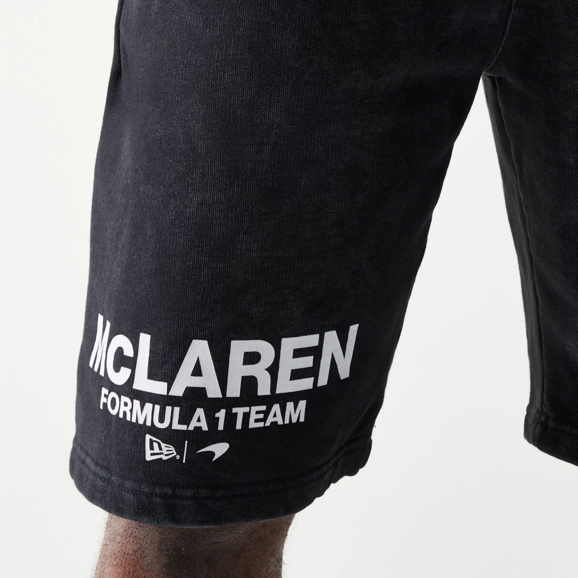 The Male model is wearing McLaren Racing Wordmark Black Oversized Shorts 4