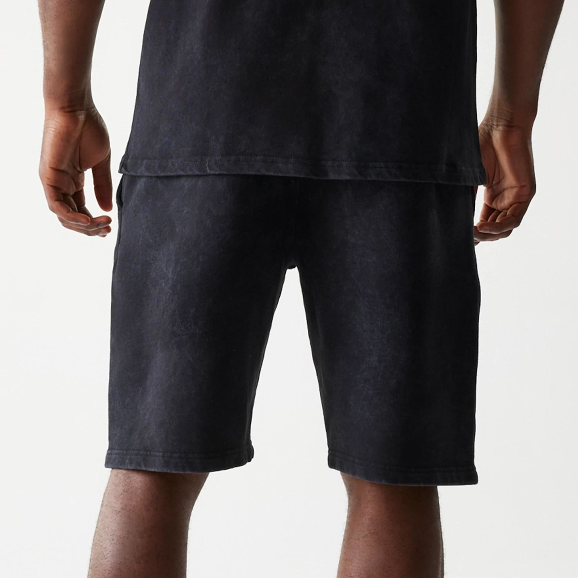 The Male model is wearing McLaren Racing Wordmark Black Oversized Shorts 6