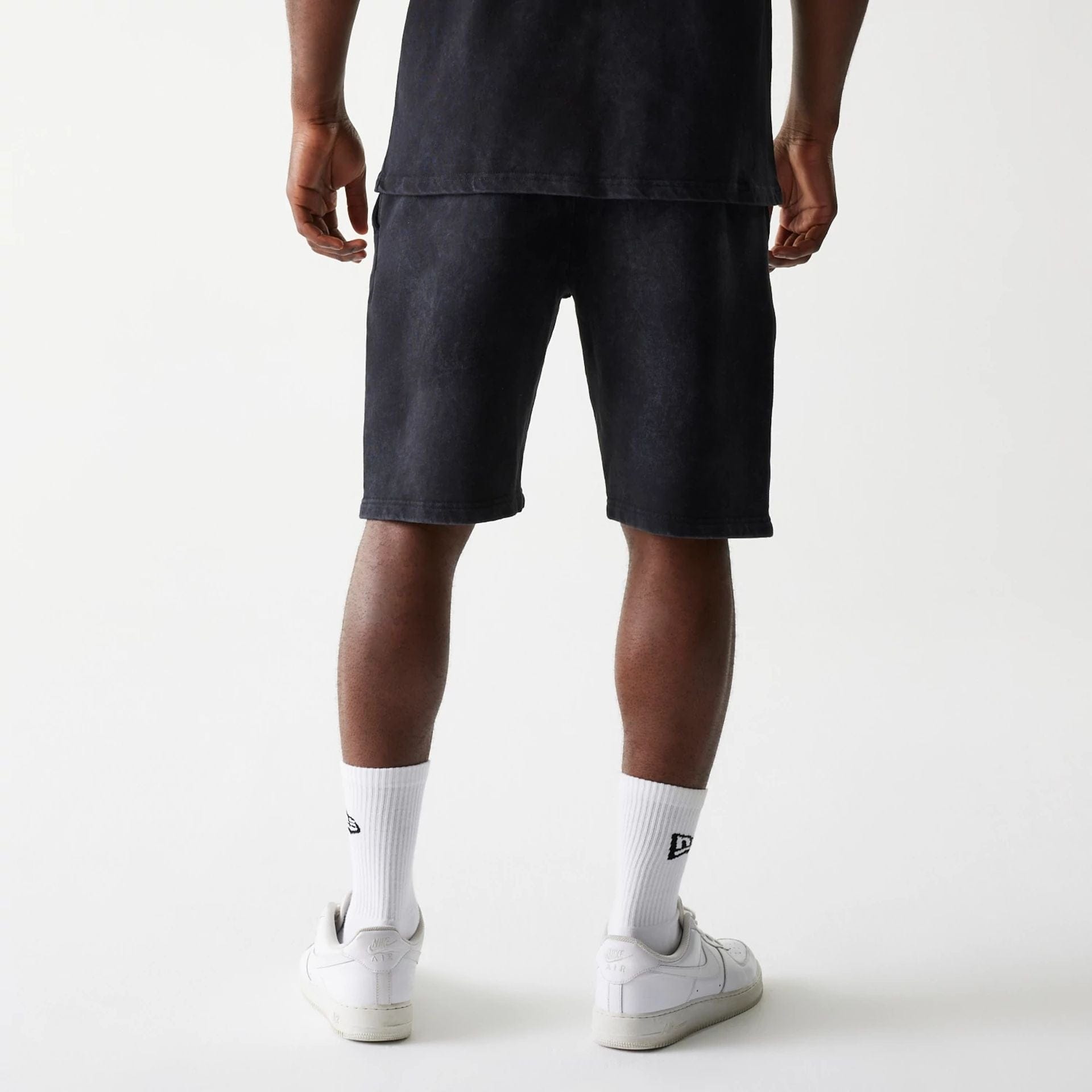The Male model is wearing McLaren Racing Wordmark Black Oversized Shorts 2