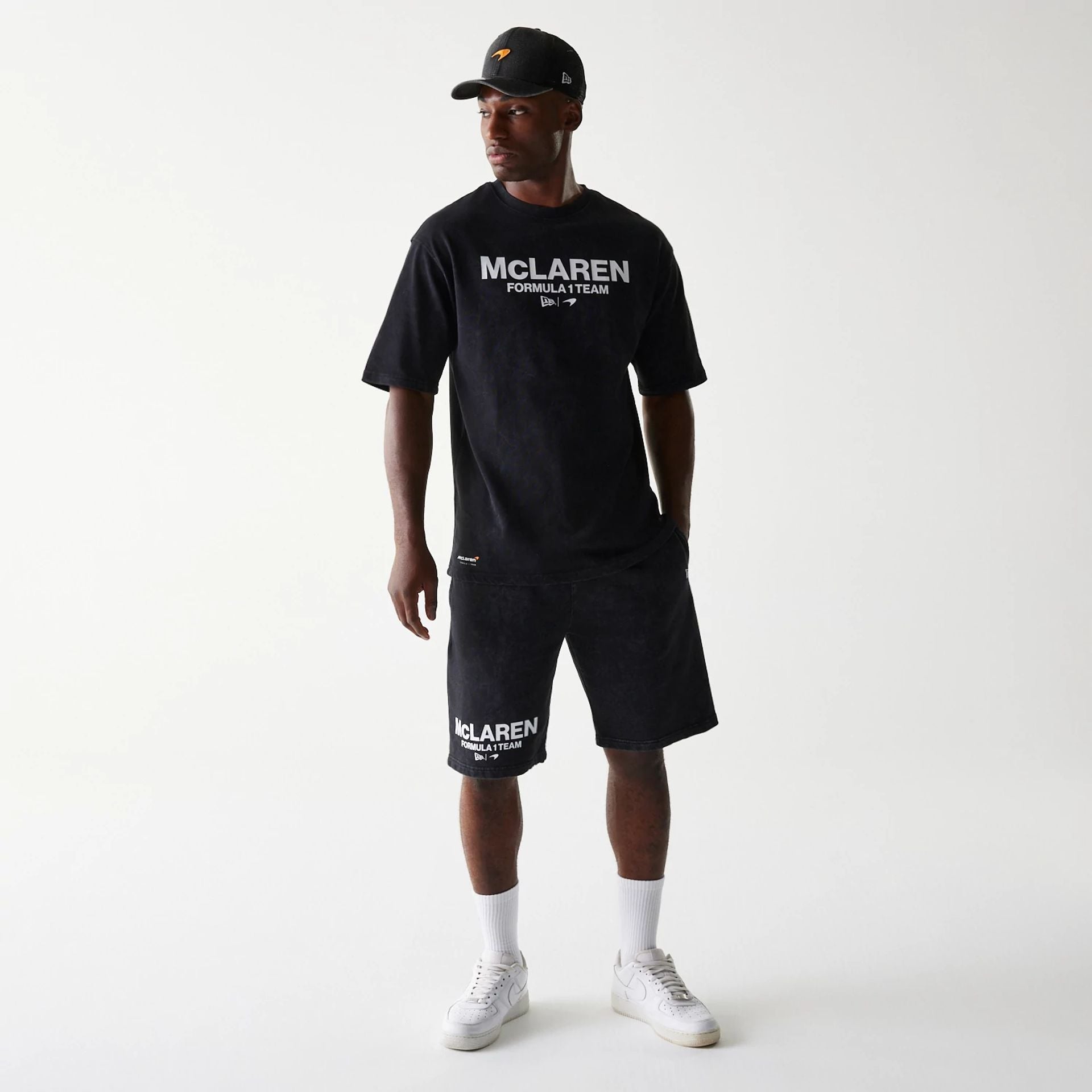 The Male model is wearing McLaren Racing Wordmark Black Oversized Shorts 7