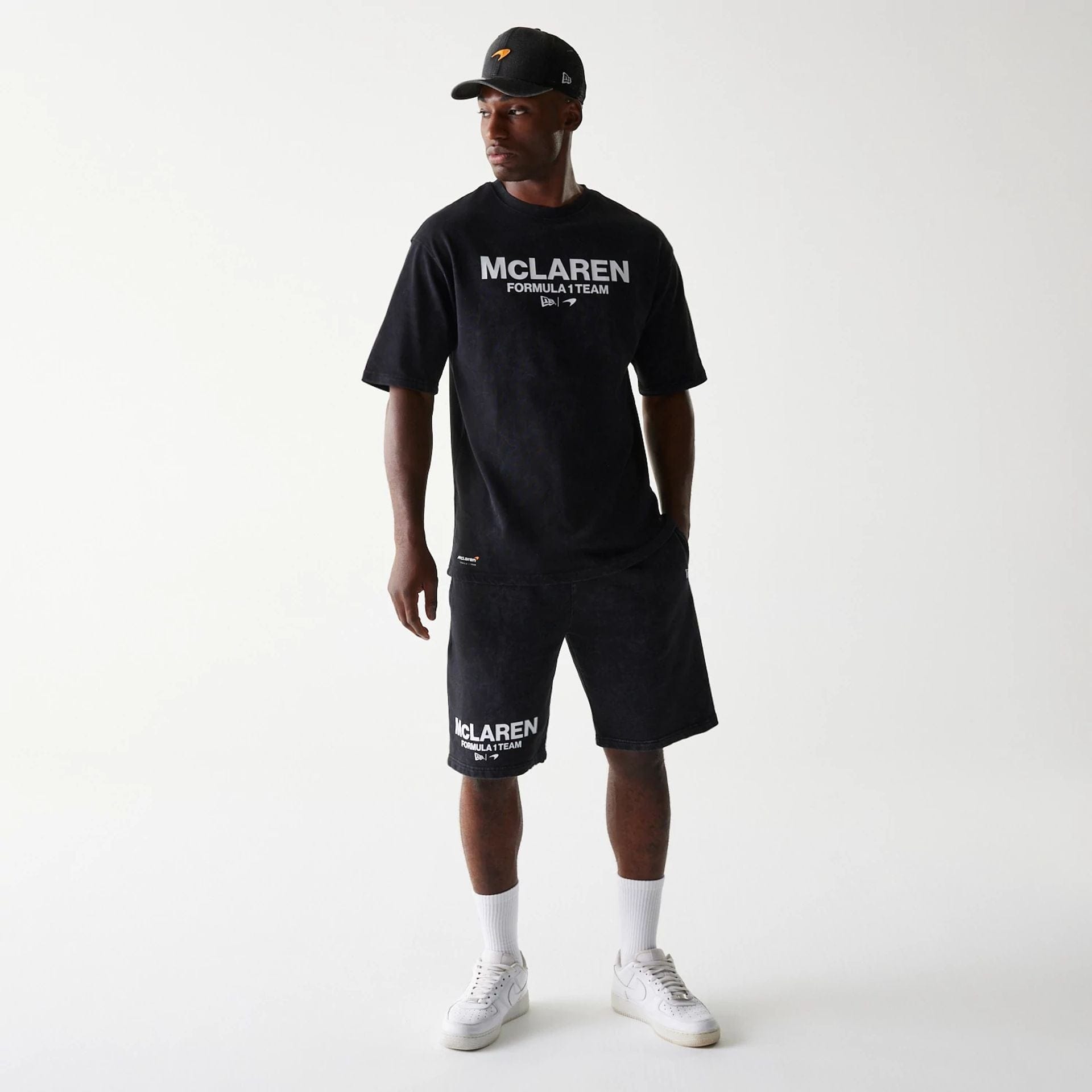 The Male model is wearing McLaren Racing Wordmark Black Oversized Shorts 7