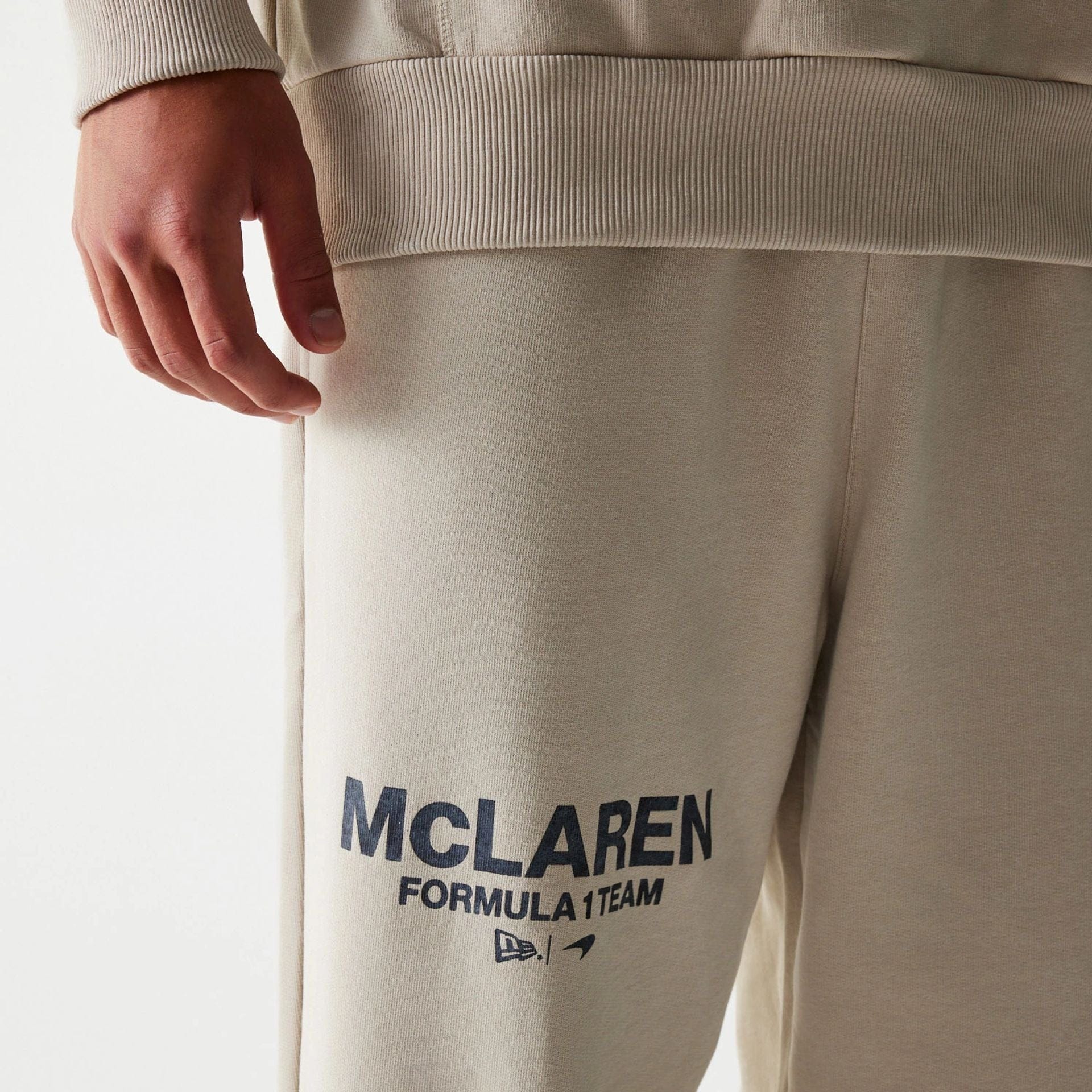 The Male model is wearing McLaren Racing Light Beige Straight Leg Joggers 3