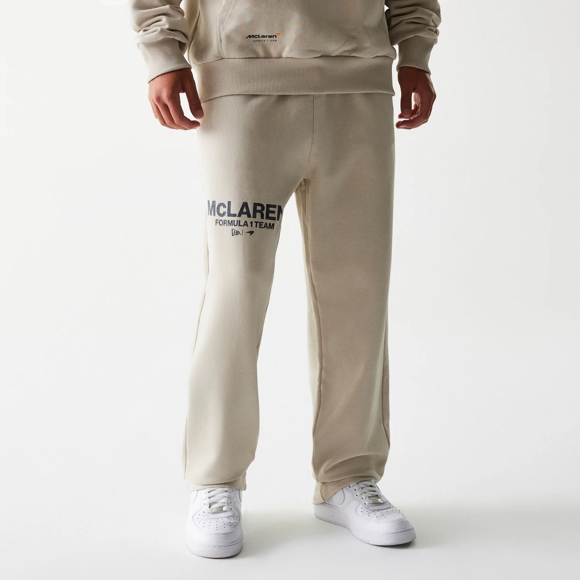 The Male model is wearing McLaren Racing Light Beige Straight Leg Joggers 1