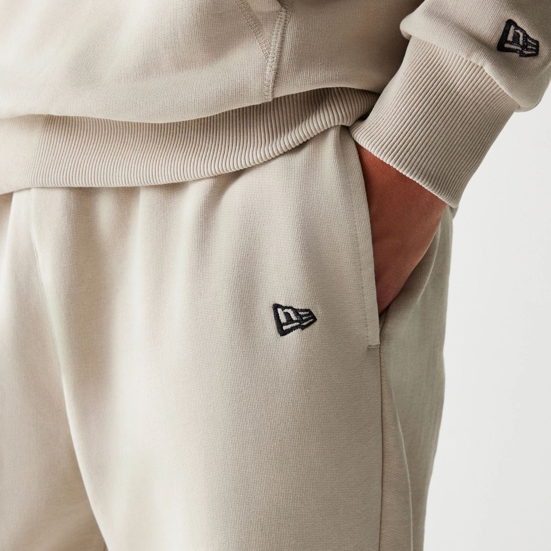 The Male model is wearing McLaren Racing Light Beige Straight Leg Joggers 4