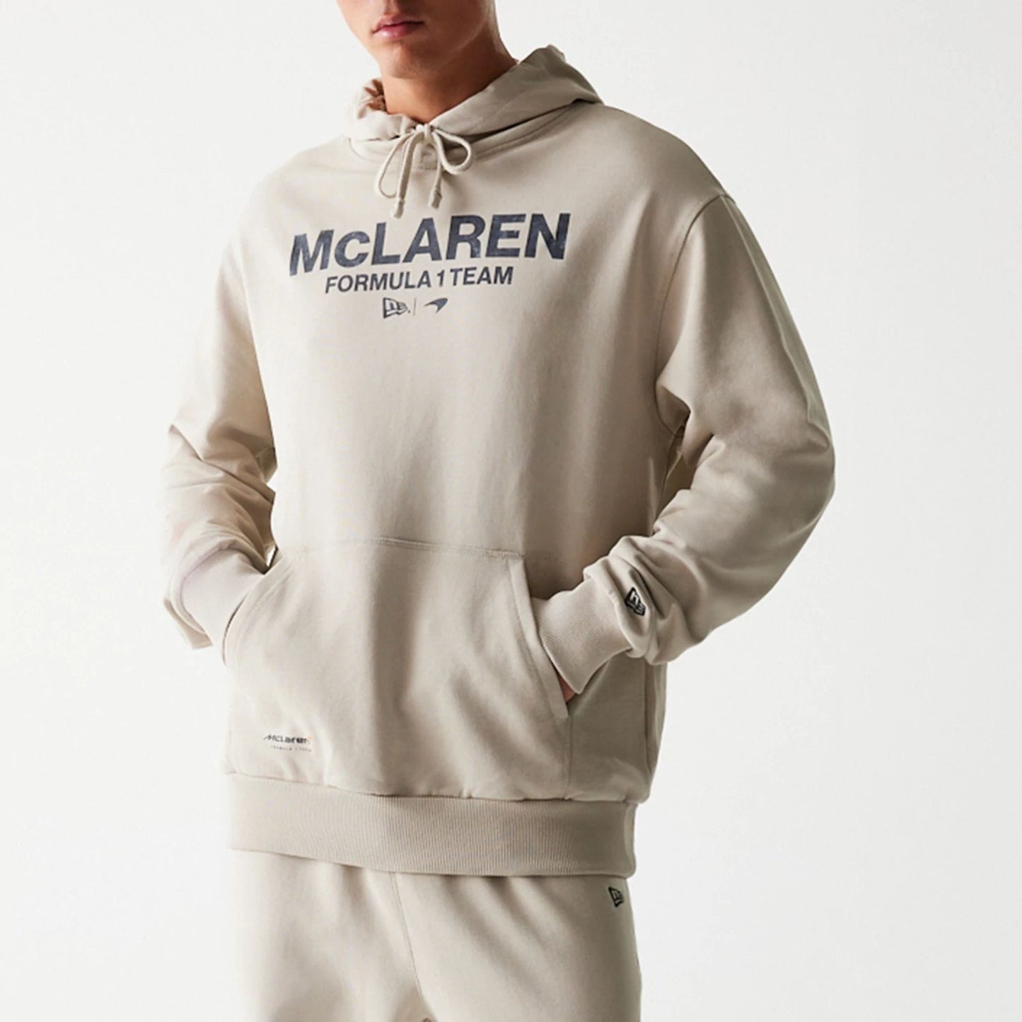 The Male model is wearing McLaren Racing Wordmark Light Beige Oversized Pullover Hoodie 6