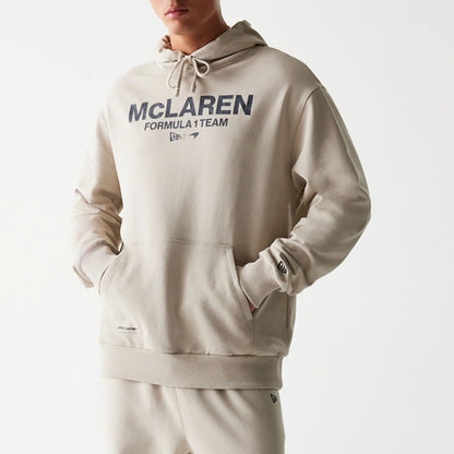 The Male model is wearing McLaren Racing Wordmark Light Beige Oversized Pullover Hoodie 6