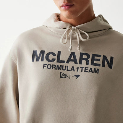 The Male model is wearing McLaren Racing Wordmark Light Beige Oversized Pullover Hoodie 3