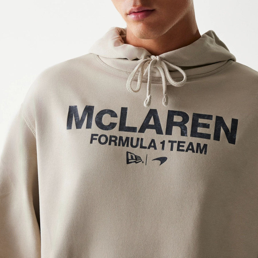 The Male model is wearing McLaren Racing Wordmark Light Beige Oversized Pullover Hoodie 3