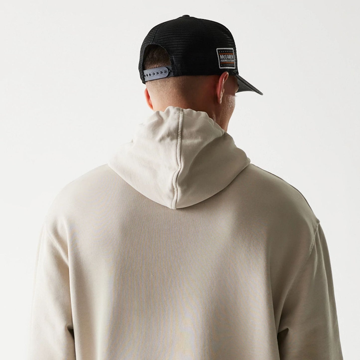 The Male model is wearing McLaren Racing Wordmark Light Beige Oversized Pullover Hoodie 7